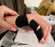 Taping applied to injured fingers and a hand to facilitate a speedy heeling process 